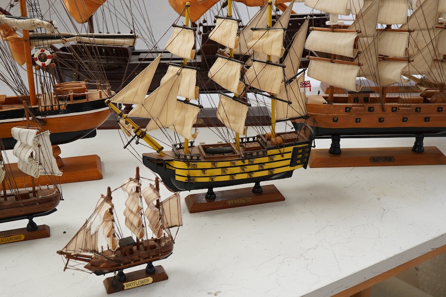 A collection of ten wooden models of famous ships including; the Cutty Sark, HMS Victory, the Mayflower, Revenge, and Santa Maria, largest 125cm wide